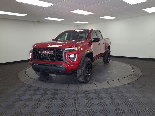 2026 GMC Canyon Elevation in Volcanic Red Tintcoat — front three-quarter view