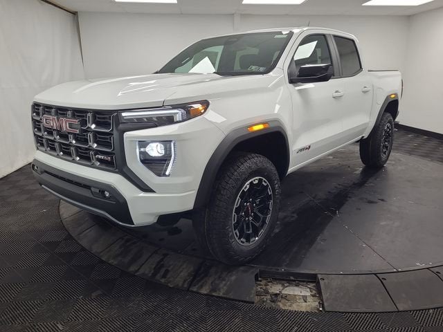 2026 GMC Canyon AT4 in Summit White — front three-quarter view